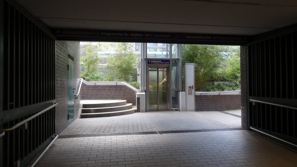 A large open doorway featuring a lift, providing access to different levels of the building.